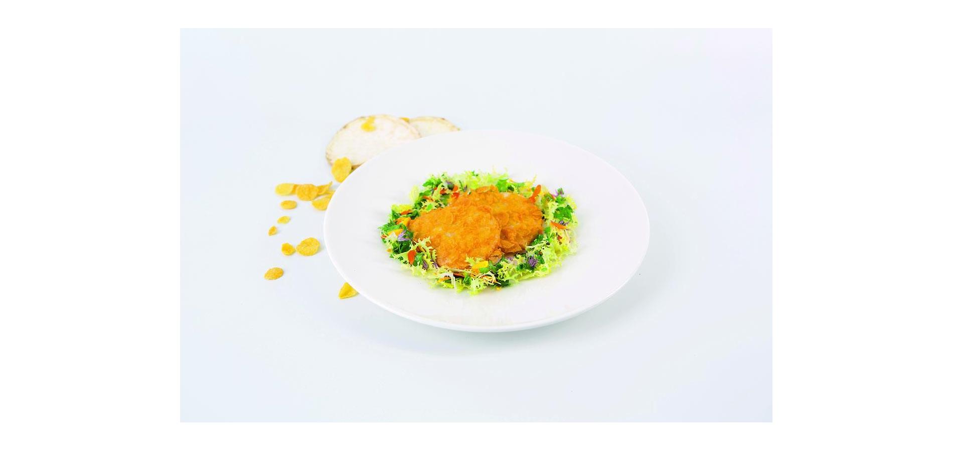 Celery cutlet baked with corn flakes and herb salad